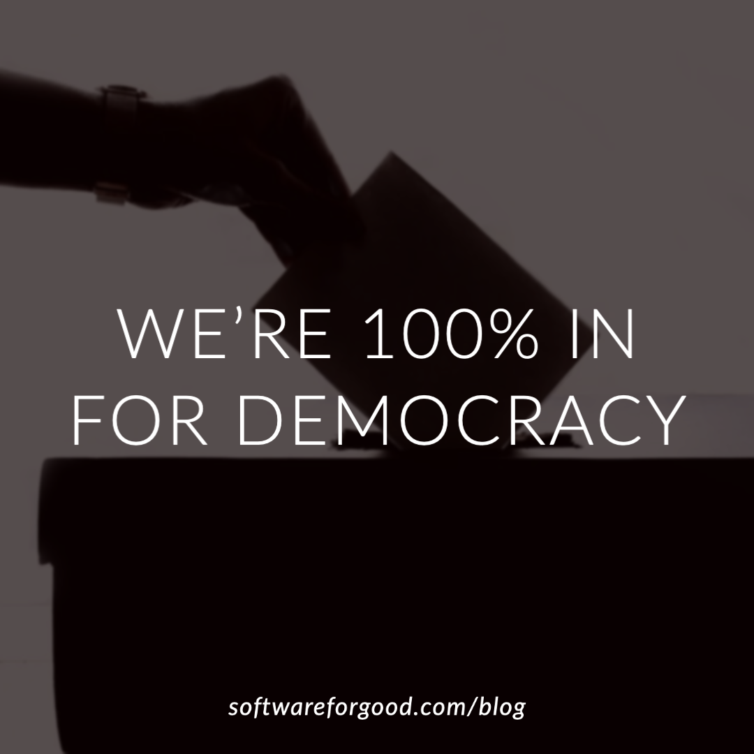 Image of a hand putting a ballot into a box with text 